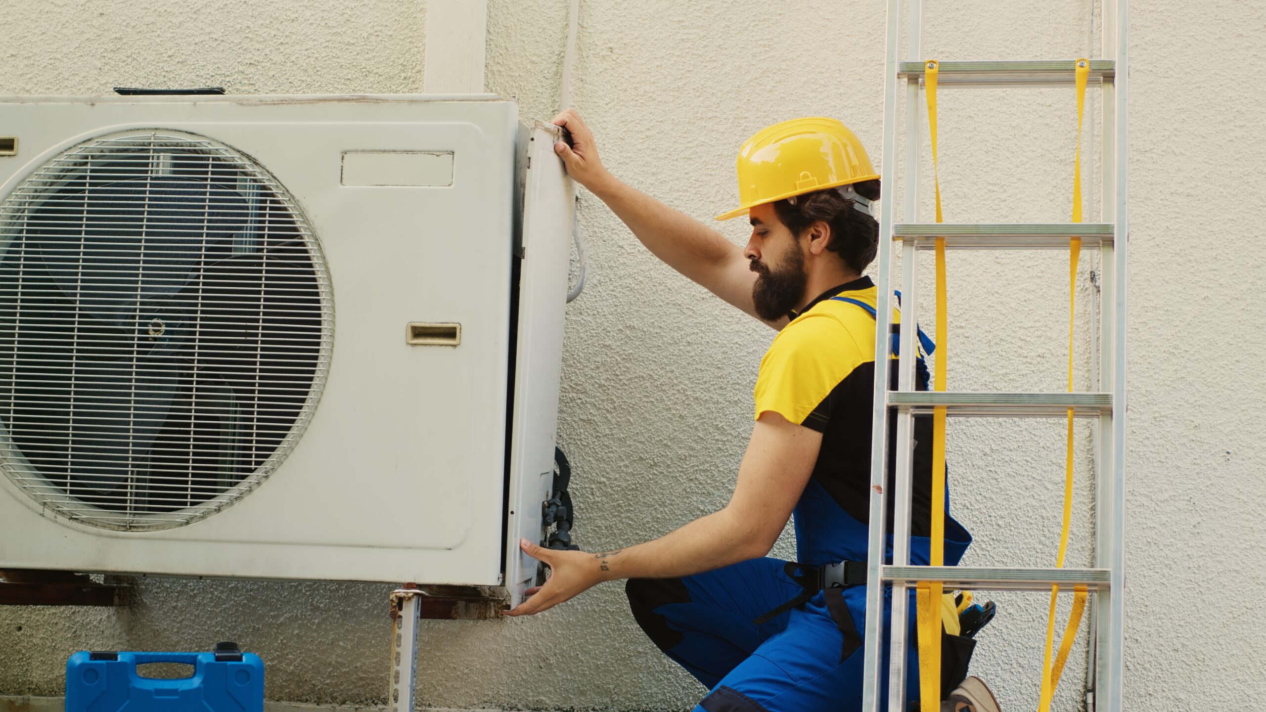 Wireman dissasembling air conditioner